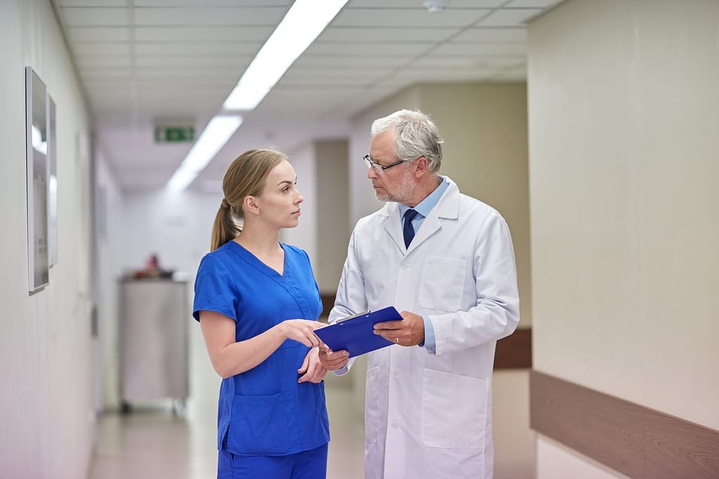 Nurse going over report with a doctor