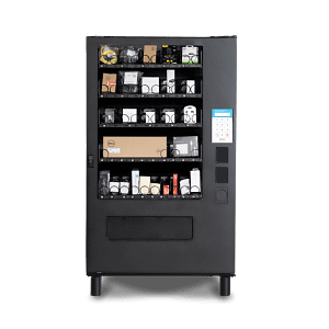 A refrigerated vending machine with multiple shelves displaying various packaged items, equipped with a touchscreen and keypad for secure access.