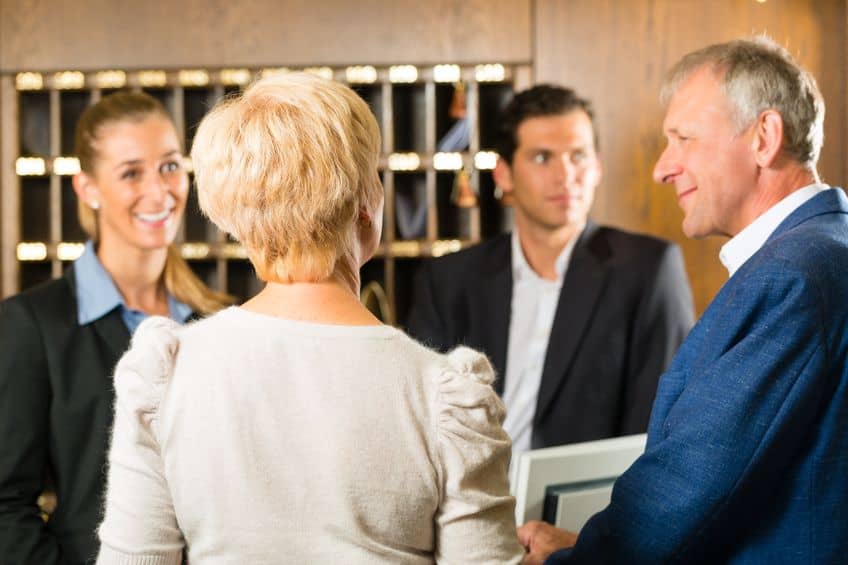 Couple checking into a hotel